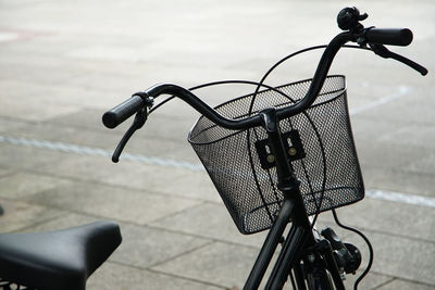 Close-up of bicycle on footpath