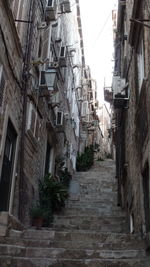 Houses in town against sky