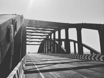 Low angle view of footbridge against sky