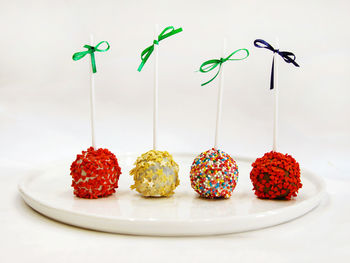 Various fruits on table against white background