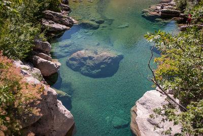 High angle view of rocks by sea