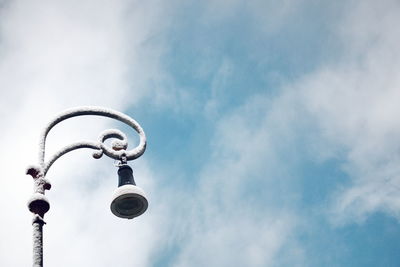 Low angle view of street light against sky