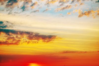 Low angle view of dramatic sky during sunset