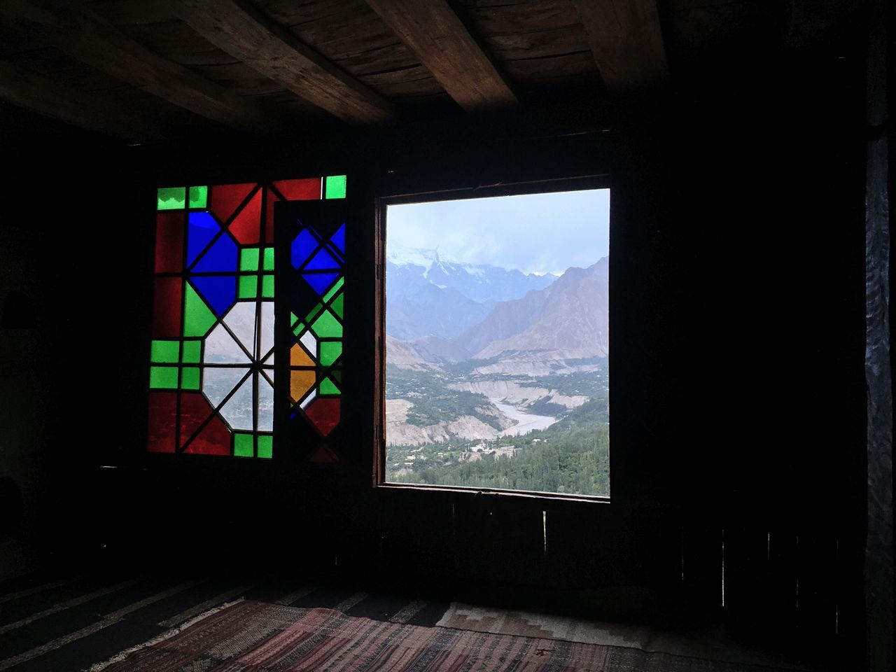 VIEW OF BUILDING THROUGH WINDOW