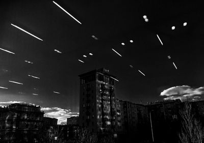 Low angle view of illuminated building against sky