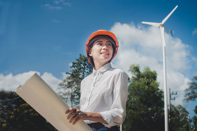 Side view of woman wearing hardhat