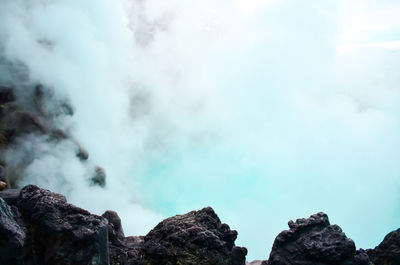 Low angle view of rocks against sky