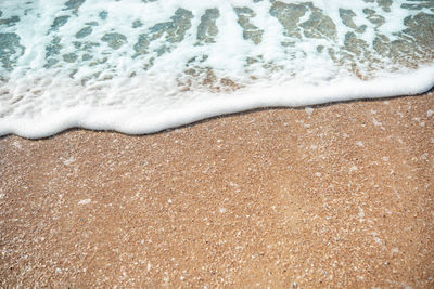 High angle view of surf on beach