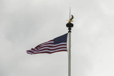 Low angle view of flag against sky