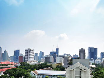 Buildings in city against sky