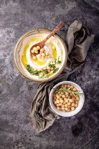 High angle view of hummus in bowl on table