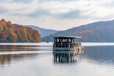 Tourist boat on lake at plitvice lakes national park in croatia in autumn