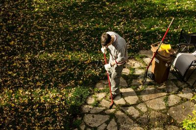 High angle view of mature man working at park