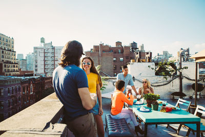 People standing in front of cityscape