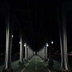 Illuminated bridge at night