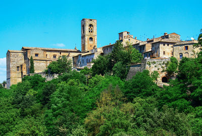Low angle view of buildings against blue sky