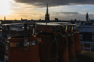 View of buildings in city at sunset