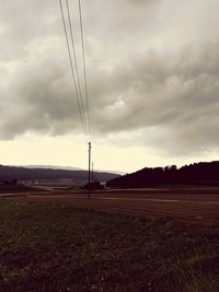 Scenic view of landscape against cloudy sky