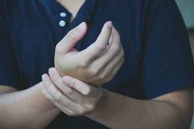 Midsection of couple hands