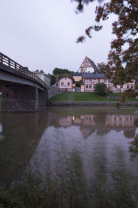 River by built structure against sky