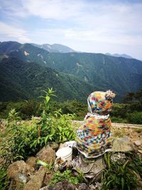 Scenic view of multi colored mountains against sky