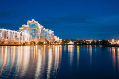 Reflection of illuminated buildings in water at night