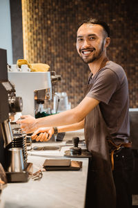 Midsection of man working at table