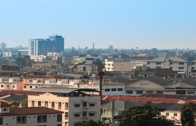 High angle view of buildings in city against clear sky