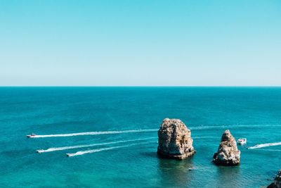 Scenic view of sea against clear sky