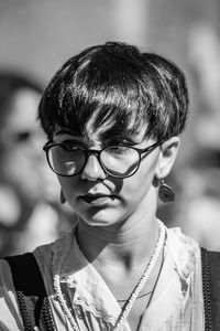 Close-up of woman with eyeglasses looking away