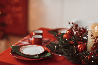 Close-up of christmas decorations on table at home