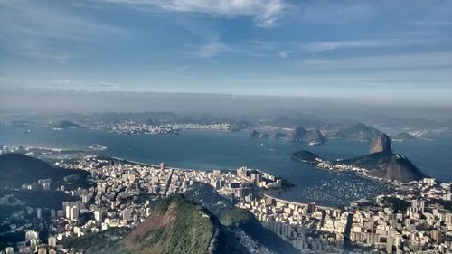 High angle view of city against cloudy sky