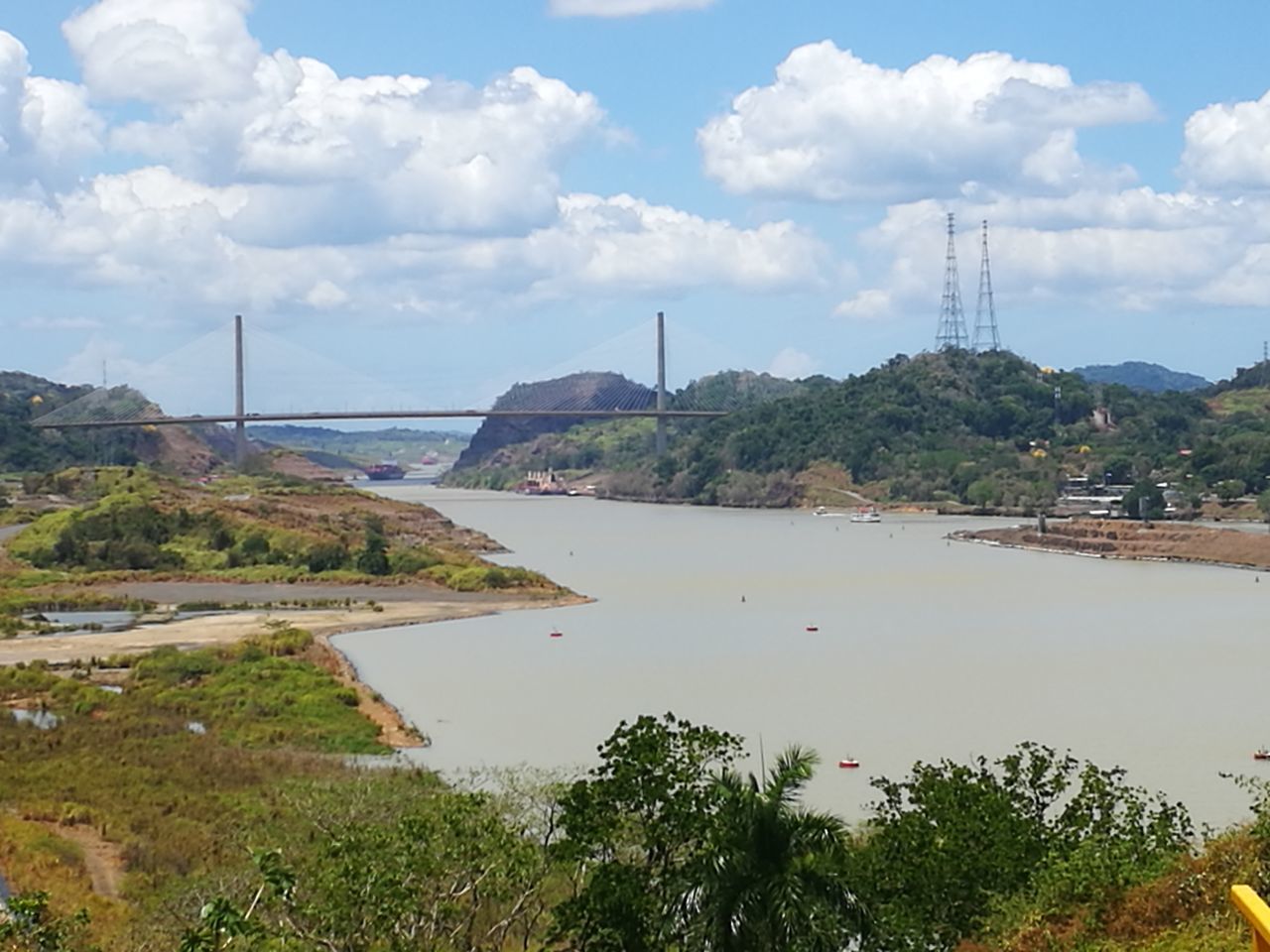 water, sky, cloud - sky, river, outdoors, electricity, tree, no people, bridge - man made structure, landscape, day, nature, architecture