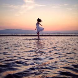 Scenic view of calm sea at sunset