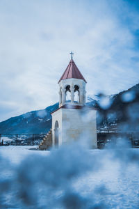 Building against sky during winter