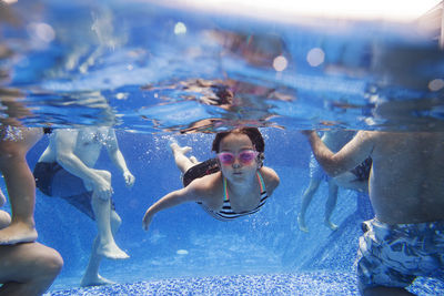 High angle view of children swimming in pool