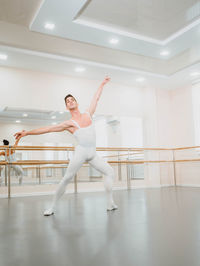 Full length of man dancing in ballet studio