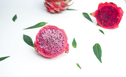 High angle view of strawberries on table against white background