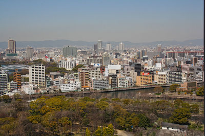 High angle view of buildings in city against clear sky