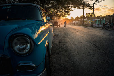 Blue car parked on street