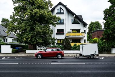 Cars parked outside house