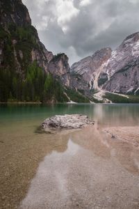 Scenic view of lake against cloudy sky