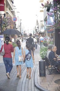 High angle view of people walking on city street