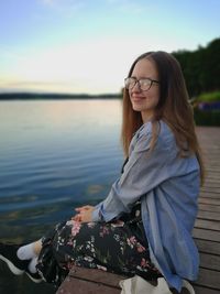 Portrait of smiling young woman in water