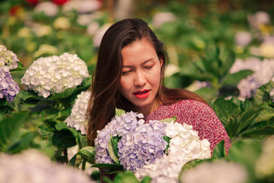 Close-up of woman holding flower bouquet