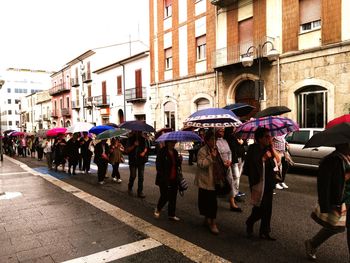 People walking on street in city