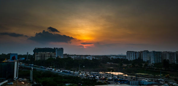 High angle view of buildings against sky during sunset