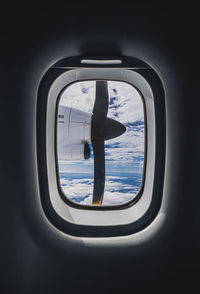 Propeller seen through airplane window