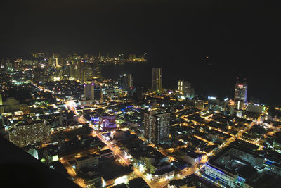 High angle view of illuminated buildings in city at night