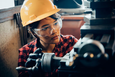 Close-up of woman working with equipment